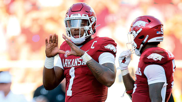 Arkansas QB KJ Jefferson signals plays against Cincinnati.